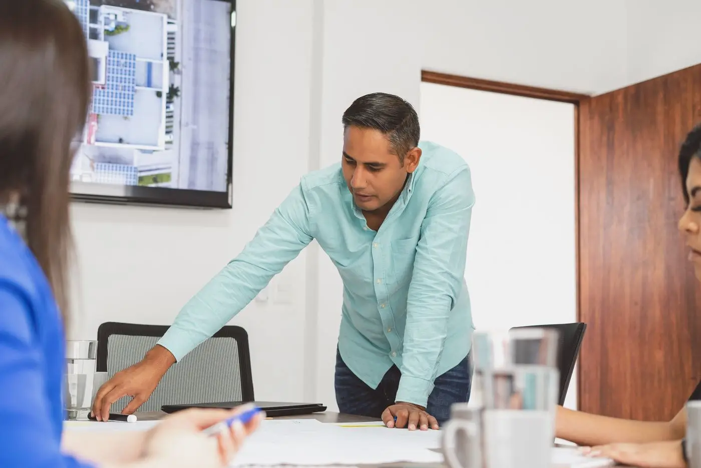 A sales manager leading a planning session with his team
